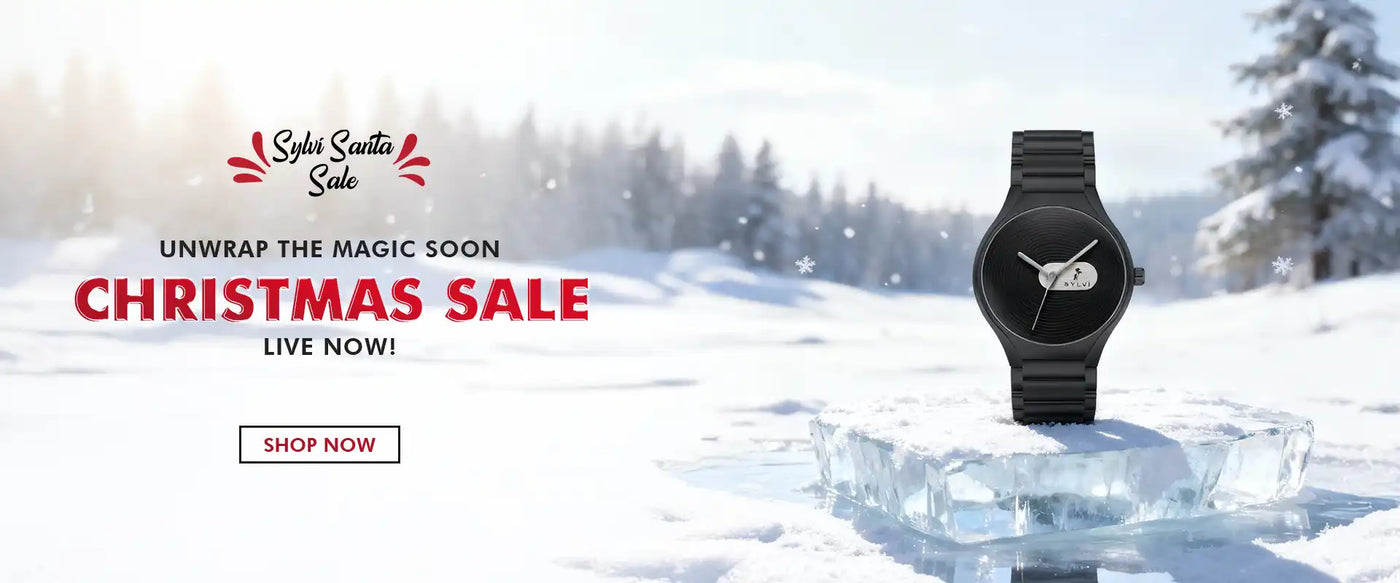 Black watch on a snowy landscape with Christmas sale text and branding.