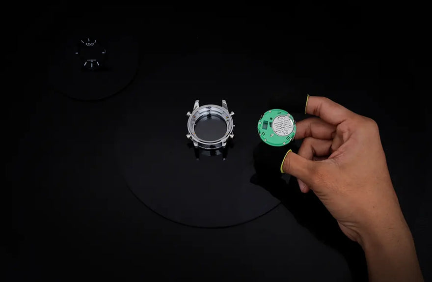 Hawk brown silver watch movement assembly during manufacturing process