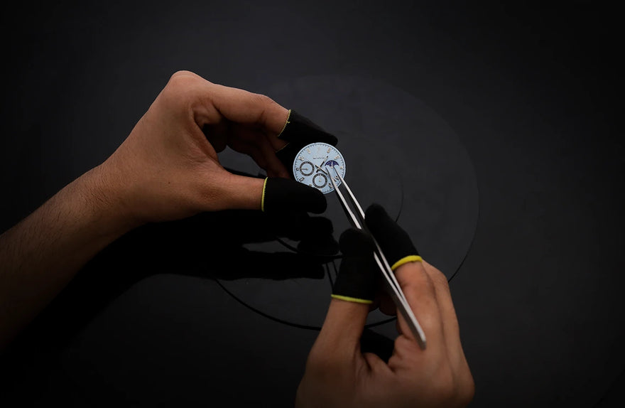Close-up watch hands styling of LunarDrive Metallic Ice Blue luxury watch
