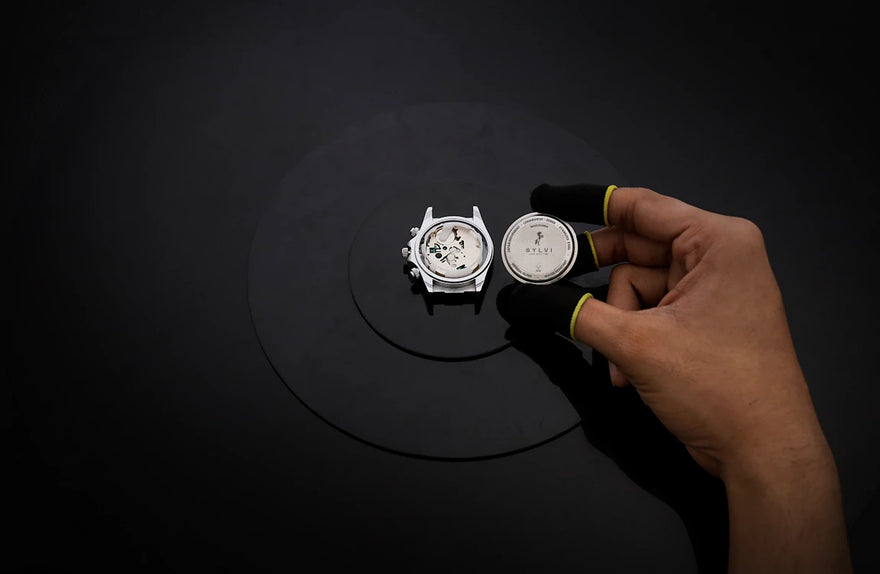LunarDrive Metallic White caseback close-up with polished steel finish