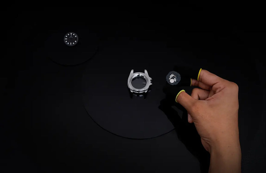 Ocean Y black red silver watch movement setup during manufacturing process