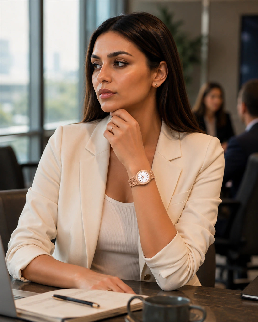 Woman wearing the Sylvi Sia rose-gold watch during a business meeting