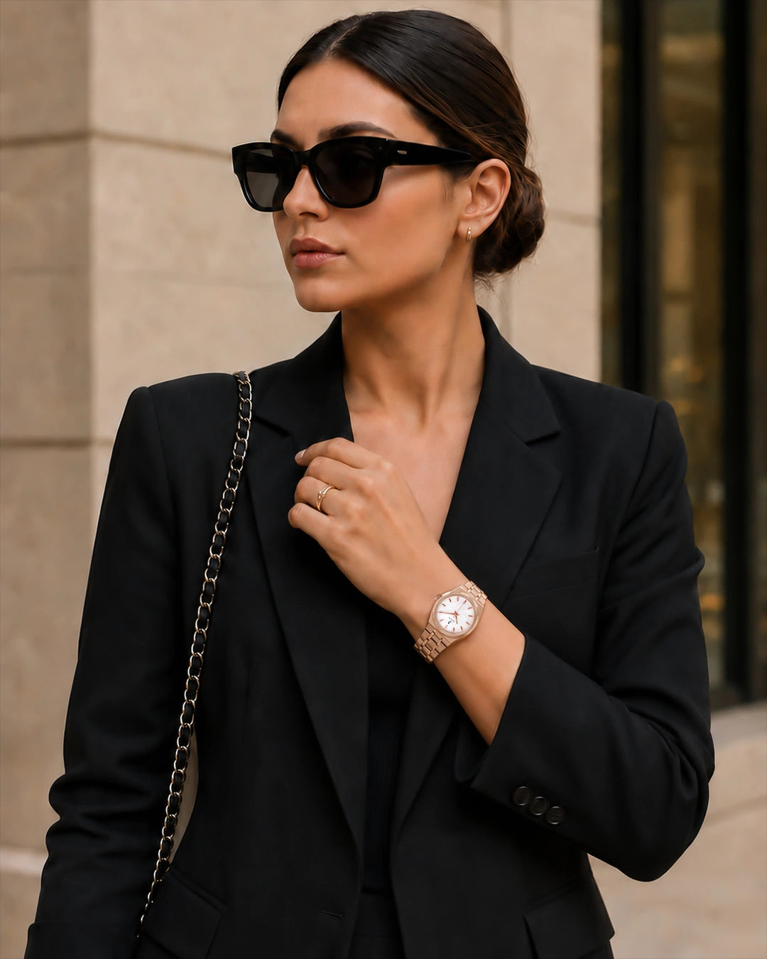 Woman wearing the Sylvi Sia rose-gold watch at an office desk