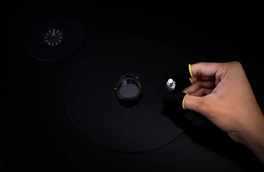 Specter black steel watch movement integration during manufacturing process