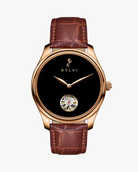 Sylvie watch with brown leather strap and black face on a white background
