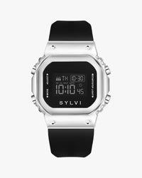 Digital watch with black strap and silver case on a white background