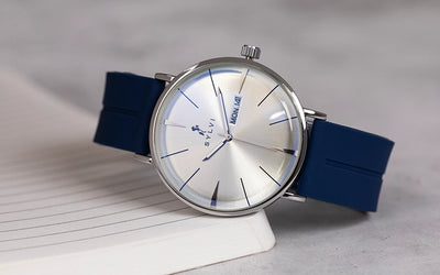 Sylvi Elegadoom White Blue PU Strap Watch Side Angle Image with Book