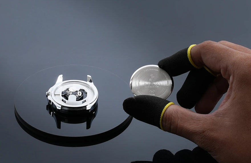 Urbanic watch manufacturing caseback assembly, stainless steel watch back fitting, precision analog watch making India
