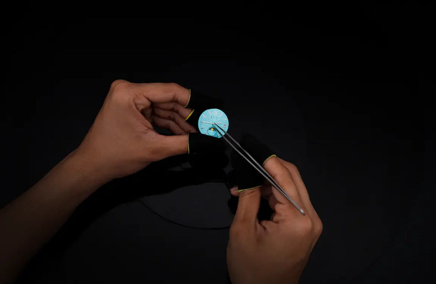 Urbane Moon aqua blue watch hands installation with smooth alignment and refined detailing