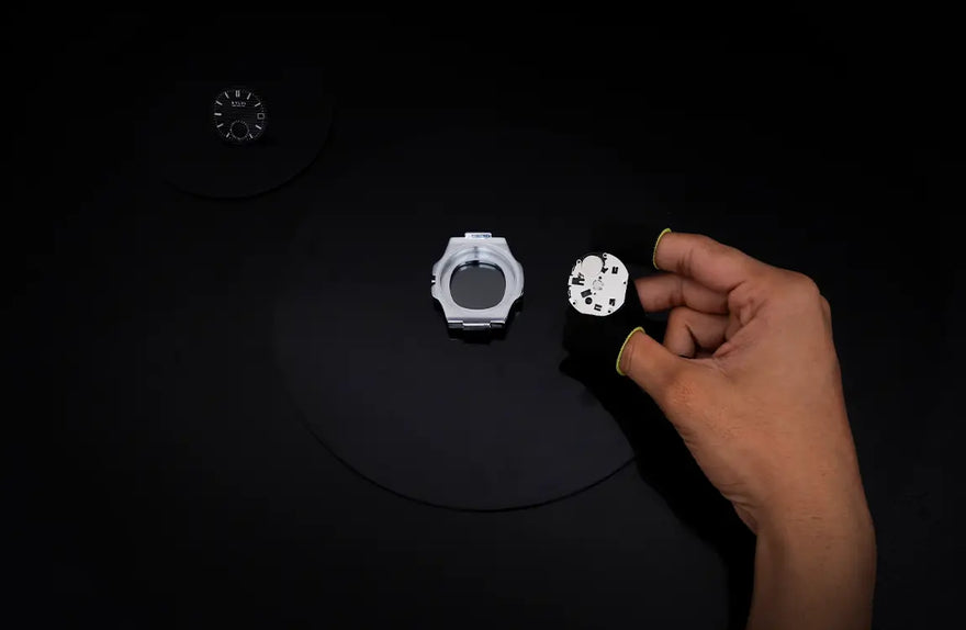 Urbane Moon black silver watch movement installation ensuring smooth performance