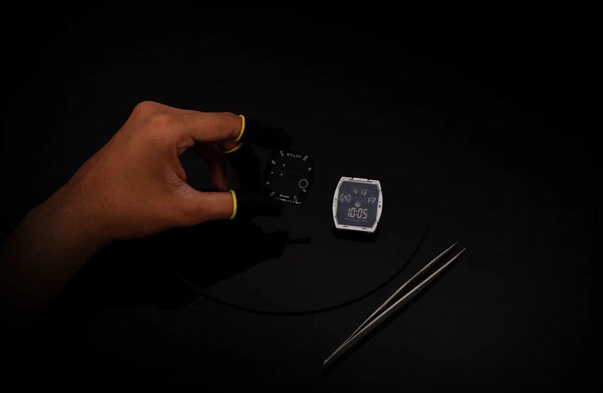 Sylvi Vanguard black white silicone watch dial module being held during watch assembly process