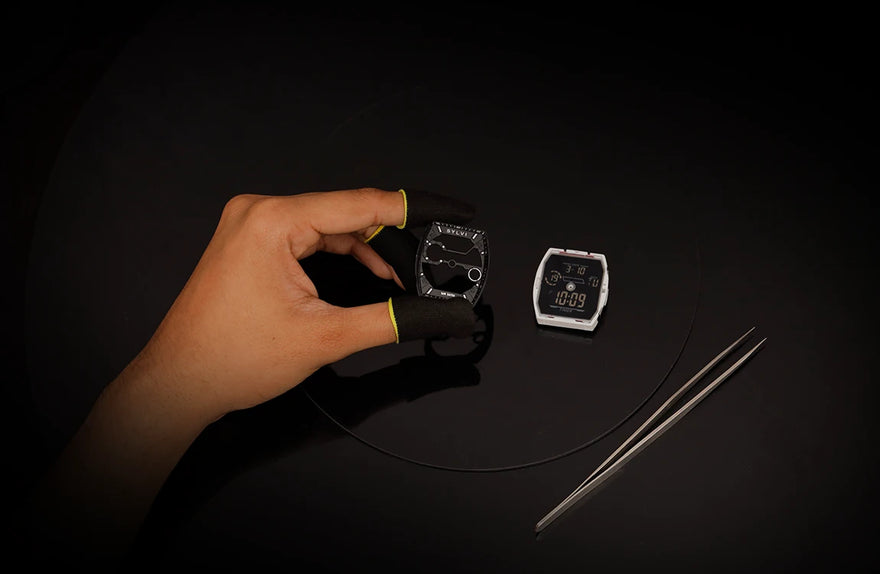 Sylvi Vanguard all black silicone watch dial component during precision assembly process
