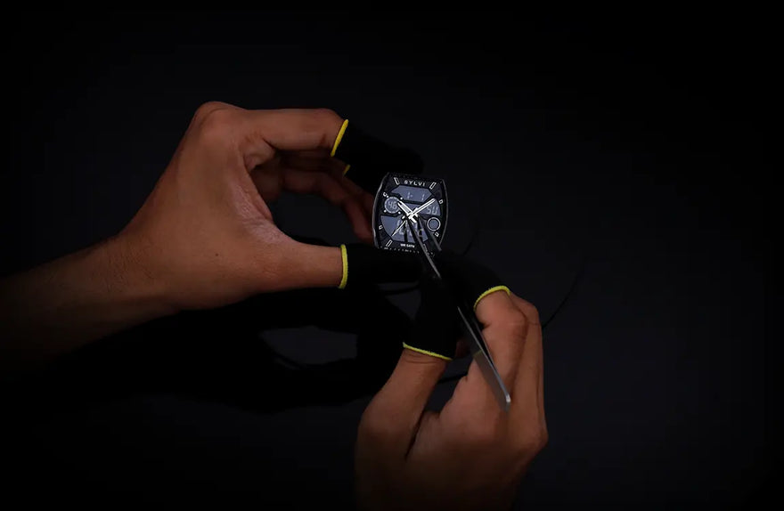 Technician installing hands on Sylvi Vanguard black silver silicone hybrid analog digital watch