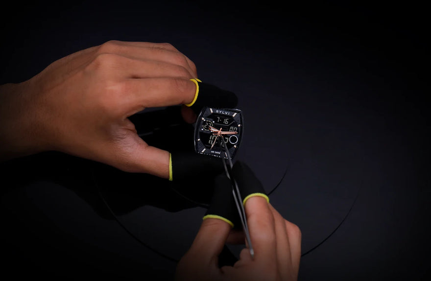 Technician installing hands on Sylvi Vanguard black rosegold silicone hybrid analog digital watch