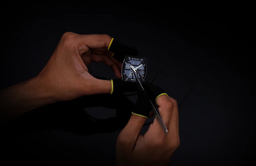 Technician installing hands on Sylvi Vanguard black white silicone hybrid analog digital watch
