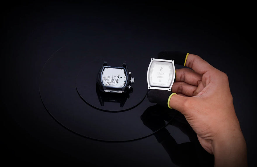 Sylvi Vanguard black silver silicone watch movement and case back during assembly process